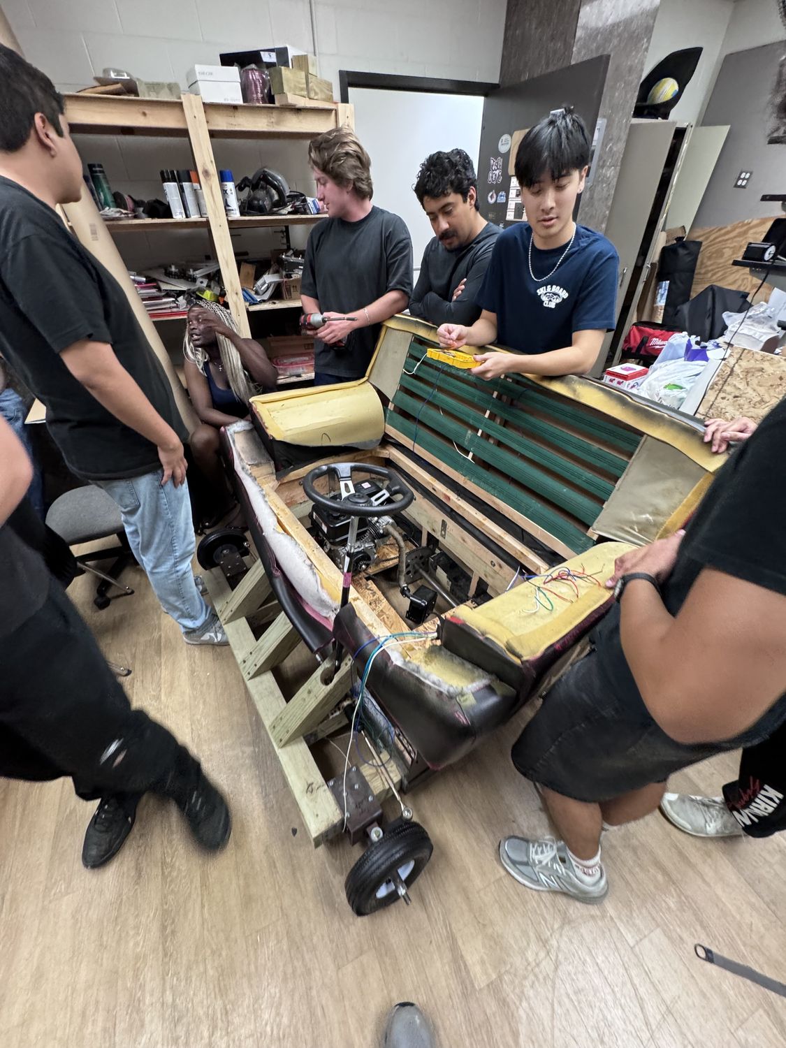 ASME team assembling the driveable couch frame and wiring